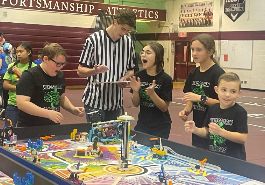  Mindstorm Masters students cheer on their team at ThunderQuest competition